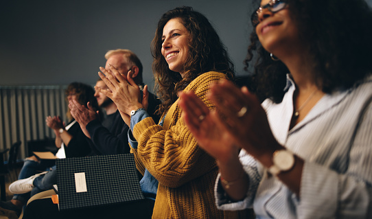 Professionals applauding at an event